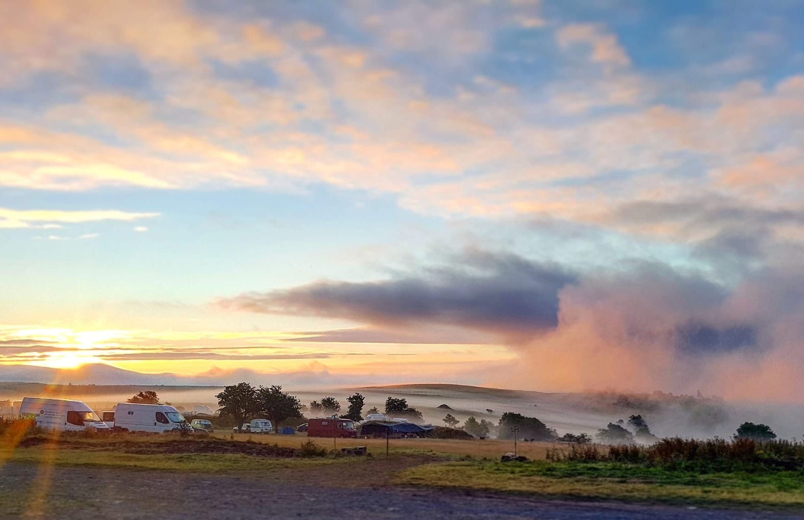 A herd of campervans in the mist